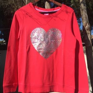 Red sweatshirt with silver heart